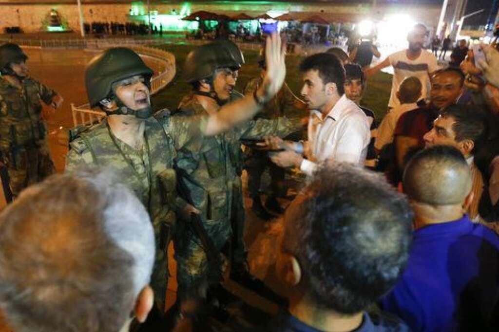 Turkish military discuss with people at the Taksim Square in Istanbul, Turkey, July 16, 2016. REUTERS/Murad Sezer