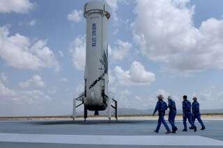VAN HORN, TEXAS - JULY 20: Blue Origin’s New Shepard crew (L-R) Jeff Bezos, Wally Funk, Oliver Daemen, and Mark Bezos walk near the booster to pose for a picture after flying into space in the Blue Origin New Shepard rocket on July 20, 2021 in Van Horn, Texas. Mr. Bezos and the crew were the first human spaceflight for the company. (Photo by Joe Raedle/Getty Images)