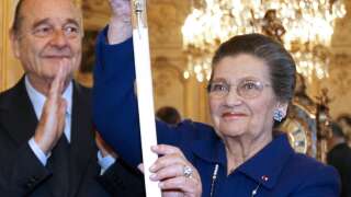 French politician Simone Veil (R) stands with former president Jacques Chirac (L) as she displays her ceremonial epee she received as a new member of the French Academy during a ceremony at the French Senate in Paris?, on March 16, 2010. Veil will officially become a member of the French Academy (Academie Francaise) in a ceremony in Paris on March 18, 2010.  AFP PHOTO CHARLES PLATIAU (Photo credit should read CHARLES PLATIAU/AFP/Getty Images)