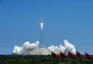 The rocket carrying China’s second module for its Tiangong space station lifts off from Wenchang spaceport in southern China on July 24, 2022. - China on July 24 launched the second of three modules needed to complete its new space station, state media reported, the latest step in Beijing's ambitious space programme. (Photo by CNS / AFP) / China OUT