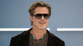 US actor Brad Pitt poses as he arrives to attend the UK Gala Screening of the film 