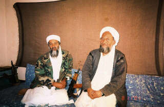 FILE PHOTO: Osama bin Laden sits with his adviser Ayman al-Zawahiri, an Egyptian linked to the al Qaeda network, during an interview with Pakistani journalist Hamid Mir (not pictured) in an image supplied by Dawn newspaper November 10, 2001.  Hamid Mir/Editor/Ausaf Newspaper for Daily Dawn/Handout via REUTERS/ THIS IMAGE HAS BEEN SUPPLIED BY A THIRD PARTY./File Photo