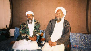 FILE PHOTO: Osama bin Laden sits with his adviser Ayman al-Zawahiri, an Egyptian linked to the al Qaeda network, during an interview with Pakistani journalist Hamid Mir (not pictured) in an image supplied by Dawn newspaper November 10, 2001.  Hamid Mir/Editor/Ausaf Newspaper for Daily Dawn/Handout via REUTERS/File Photo