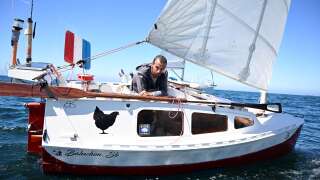Yann Quenet is pictured off Trebeurden coasts, western France on August 2, 2022, as he completes his world tour with stopovers on his 4-meter boat 