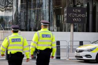 Britain's police officers patrol in front of Scotland Yard, central London, on February 14, 2022. (Photo by Tolga Akmen / AFP)
