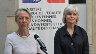 France's Prime Minister Elisabeth Borne (L) delivers a speech next to French Minister for Gender Equality, Diversity and Equal Opportunities Isabelle Rome (R) during a visit of the LGBT+ GAGL45 (Groupe d'action gay, lesbien du Loiret)'s centre in Orleans, central France, on August 4, 2022. (Photo by GUILLAUME SOUVANT / AFP)