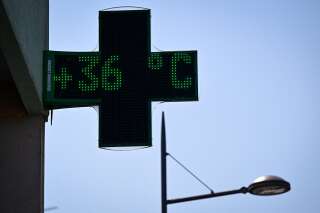 A pharmacy sign displays a temperature of 36°C in Riedisheim, eastern France, on June 19, 2022, as a heat wave hits France. (Photo by SEBASTIEN BOZON / AFP)