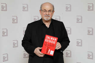In this file photo taken on October 13, 2019, British author Salman Rushdie poses with his book 'Quichotte' during the photo call for the authors shortlisted for the 2019 Booker Prize for Fiction at Southbank Centre in London. - Rushdie, whose controversial writings made him the target of a fatwa that forced him into hiding, was stabbed in the neck by an attacker on stage Friday in western New York state, according to New York State Police. The attacked is in custody. (Photo by Tolga AKMEN / AFP)