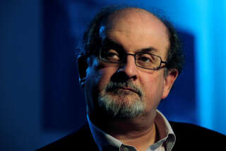 FILE PHOTO: British author Salman Rushdie listens during an interview with Reuters in London April 15, 2008.  REUTERS/Dylan Martinez/File Photo