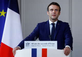 Emmanuel Macron French President Emmanuel Macron delivers a speech during a reception to mark the National Day of Remembrance and Reflection in memory of the civilian and military victims of the war in Algeria, sixty years after the signing of the Evian Accords, at the Elysee Palace in Paris, on March 19, 2022. - The 60th anniversary of the Evian agreements has brought back into the presidential campaign a part of the pieds-noirs memory, which the right and especially the extreme right have often echoed, but its electoral weight is waning over the years. (Photo by GONZALO FUENTES / POOL / AFP)