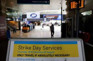 A message board warns of travel disruption at Waterloo Station in London on August 18, 2022 as Britain's train network faced further heavy disruption in major walkouts that follow the sector's biggest strike action for 30 years already this summer. - Railway and postal staff, dockers too. Britain's workers are striking in vast numbers as decades-high inflation erodes the value of wages at a record pace. (Photo by CARLOS JASSO / AFP) (Photo by CARLOS JASSO/AFP via Getty Images)