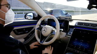 An employee makes a driving demonstration with the Drive Pilot level 3 autonomous driving system in a new Mercedes-Benz Class S.