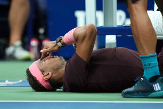 Sep 1, 2022; Flushing, NY, USA; Rafael Nadal of Spain lays down after an injury to his nose during a match against Fabio Fognini of Italy on day four of the 2022 U.S. Open tennis tournament at USTA Billie Jean King Tennis Center. Mandatory Credit: Danielle Parhizkaran-USA TODAY Sports
