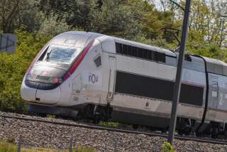 A SNCF's low-cost Ouigo TGV trains passes at high speed in the direction of Paris on June 2, 2021 at the train station in Neuville Vitasse, northern France. - The rail operator presented its new fare offer on June 1, hoping to be able to bring many travelers back to its trains after a catastrophic year in 2020. (Photo by Denis Charlet / AFP)