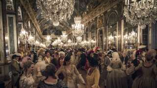 Grand ball in the Hall of Mirrors, courtship party (Fete galante) with participants wearing clothes from the Louis XIV period, Palace of Versailles, France. Historical reenactment.