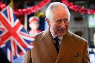 Britain's Prince Charles, Prince of Wales, meets market traders during a visit to Cambridge Market in eastern England on November 23, 2021. (Photo by HENRY NICHOLLS / POOL / AFP)