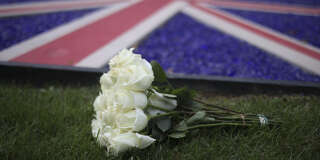 WASHINGTON, DC - SEPTEMBER 08: Flowers are laid outside the British Embassy after the death of Queen Elizabeth II was announced on September 8, 2022 in Washington, DC. Elizabeth Alexandra Mary Windsor was born in Bruton Street, Mayfair, London on 21 April 1926. She married Prince Philip in 1947 and acceded the throne of the United Kingdom and Commonwealth on 6 February 1952 after the death of her Father, King George VI.Queen Elizabeth II died at Balmoral Castle in Scotland on September 8, 2022, and is survived by her four children, Charles, Prince of Wales, Anne, Princess Royal, Andrew, Duke Of York and Edward, Duke of Wessex.    Win McNamee/Getty Images/AFP (Photo by WIN MCNAMEE / GETTY IMAGES NORTH AMERICA / Getty Images via AFP)