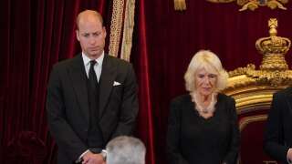 Britain's Prince William, Prince of Wales (L) and Britain's Camilla, Queen Consort listen to Britain's King Charles III (R) speak at a meeting of the Accession Council in the Throne Room inside from St James's Palace in London on September 10, 2022, to proclaim him the new king.  - Britain's Charles III was officially proclaimed king in a ceremony on Saturday, a day after he vowed in his first speech to bereaved subjects that he would emulate his 