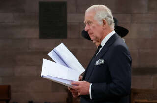 Britain's King Charles III and Britain's Camilla, Queen Consort (obscured) attend a Service of Reflection for the life of Queen Elizabeth II at St Anne's Cathedral in Belfast on September 13, 2022, during his visit to Northern Ireland. - King Charles III on Tuesday travelled to Belfast where he is set to receive tributes from pro-UK parties and the respectful sympathies of nationalists who nevertheless can see reunification with Ireland drawing closer. (Photo by Liam McBurney / POOL / AFP)