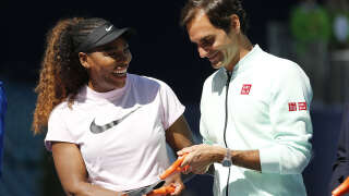 MIAMI GARDENS, FLORIDA - MARCH 20:  (L-R) Serena Williams of the United States and Roger Federer of Switzerland cut the ribbon during the Ribbon Cutting ceremony on Day 3 of the Miami Open Presented by Itau on March 20, 2019 in Miami Gardens, Florida. (Photo by Michael Reaves/Getty Images)