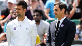 LONDON, ENGLAND - JULY 03: Novak Djokovic (L) of Serbia and Roger Federer of Switzerland attend the Centre Court Centenary Celebration during day seven of The Championships Wimbledon 2022 at All England Lawn Tennis and Croquet Club on July 03, 2022 in London, England. (Photo by Shi Tang/Getty Images)