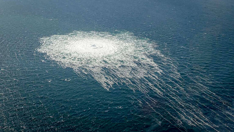 This handout picture released on September 27, 2022 by the Danish Defence Command shows the gas leak at the Nord Stream 2 gas pipeline as it is seen from the Danish Defence's F-16 rejection response off the Danish Baltic island of Bornholm, south of Dueodde. - The two Nord Stream gas pipelines linking Russia and Europe have been hit by unexplained leaks, Scandinavian authorities said on September 27, 2022, raising suspicions of sabotage. The pipelines have been at the centre of geopolitical tensions in recent months as Russia cut gas supplies to Europe in suspected retaliation against Western sanctions following its invasion of Ukraine. (Photo by Handout / DANISH DEFENCE / AFP) / RESTRICTED TO EDITORIAL USE - MANDATORY CREDIT 
