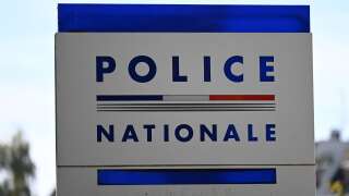 The logo of the French national police is pictured outside the main police station in Strasbourg, on October 17, 2022. - Rallies are taking place in several French cities on October 17, 2022, against the reform which would see the risk of a 'levelling down' of the prestigious judicial police, in charge of the most complex crimes and investigations. (Photo by Frederick FLORIN / AFP)