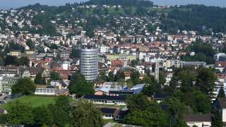 A photo taken on September 3, 2021 shows the town of St Gallen, Switzerland, with the  Silberturm silver tower office building. (Photo by Christof STACHE / AFP)