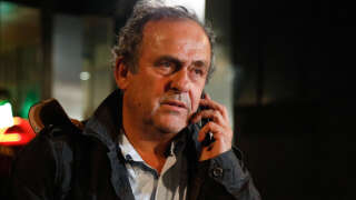 Ex-UEFA chief Michel Platini is seen leaving the Central Office for Combating Corruption and Financial and Tax Crimes after being arrested in connection with a criminal investigation into the award of the 2022 World Cup to Qatar, in Nanterre, west of Paris in the early hours of June 19, 2019. - The banned ex-UEFA chief Michel Platini was freed from French custody Wednesday, an AFP journalist said, after several hours of questioning in connection with a criminal investigation into the awarding of the 2022 World Cup to Qatar.
