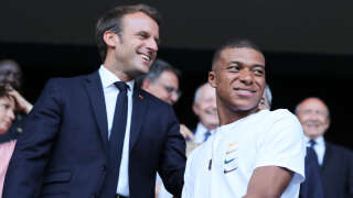 LYON, FRANCE - JULY 07:  Emmanuel Macron, President of France and French Footballer Kylian Mbappe are seen in the stands prior to the 2019 FIFA Women's World Cup France Final match between The United States of America and The Netherlands at Stade de Lyon on July 07, 2019 in Lyon, France. (Photo by Marianna Massey - FIFA/FIFA via Getty Images)