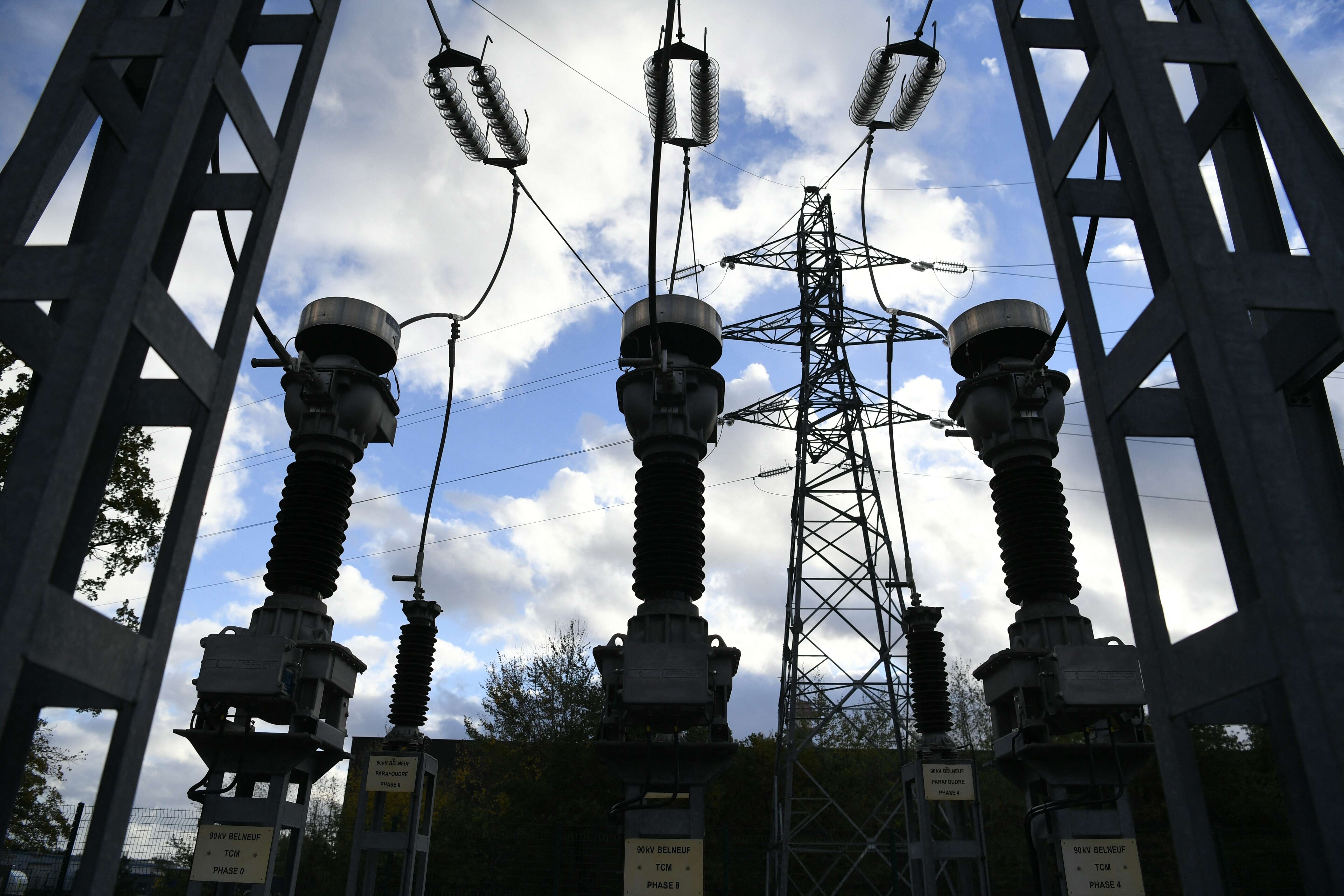 This photograph taken on November 22, 2022, shows a part of a French electricity transmission system on a power substation site of French power grid operator Enedis near Orleans, central France. (Photo by Eric PIERMONT / AFP)