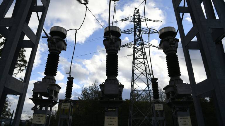 This photograph taken on November 22, 2022, shows a part of a French electricity transmission system on a power substation site of French power grid operator Enedis near Orleans, central France. (Photo by Eric PIERMONT / AFP)