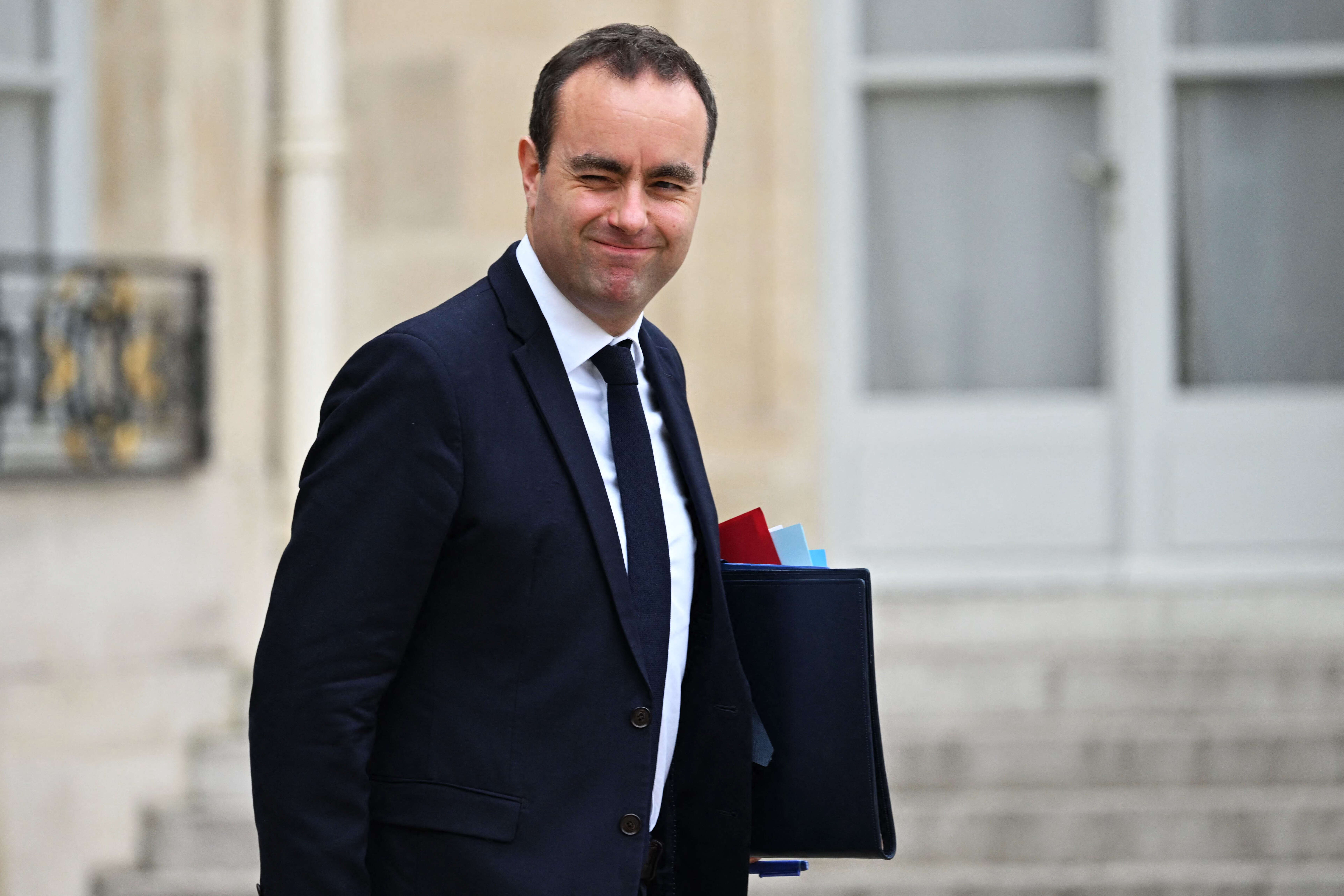 French Armies Minister Sebastien Lecornu leaves after the weekly cabinet meeting at the presidential Elysee Presidential Palace in Paris on November 29, 2022. (Photo by Emmanuel DUNAND / AFP)