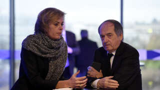 French president of the French Football Federation (FFF), Noel Le Graet (R), and FFF Marketing Director Florence Hardouin wait for the  Federal Assembly of the organisation on December 12, 2015  in Paris. - The announcement by French Football Federation president Noel Le Graet on Thursday that Real Madrid striker Benzema was suspended indefinitely from the France set-up has left national coach Didier Deschamps to focus on other options in attack in the build-up to the opening game on June 10 (Photo by FRANCK FIFE / AFP)