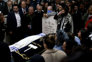 Mourners gather during the funeral of Eli Mizrahi and his wife, Natalie, who were victims of a shooting attack in east Jerusalem on January 27, 2023, in Bet Shemesh, Israel, on January 28, 2023. - Israeli Prime Minister Benjamin Netanyahu vowed 