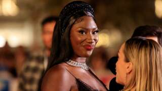 Fench-Malian singer Aya Coco Danioko aka Aya Nakamura (C) answers hosts' questions upon her arrival to attend the 24th edition of the NRJ Music Awards ceremony at the Palais des Festivals in Cannes, southeastern France, on November 18, 2022. (Photo by Valery HACHE / AFP)