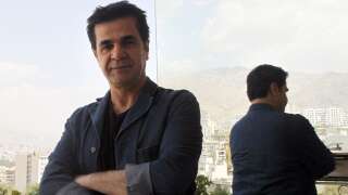 FILES - Picture taken on August 30, 2010 shows Iranian film director Jafar Panahi standing on a balcony overlooking Tehran during an interview with AFP. The International Film Festival Berlinale director Dieter Kosslick said on December 6, 2010 he had invited outspoken Iranian filmmaker Jafar Panahi, who was freed on bail after three months in a Tehran jail, to serve on its jury in February. The Cannes Film Festival had invited Panahi to join its own jury in May 2010 and the jury headed by 