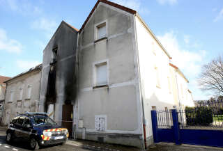 A gendarmerie vehicle is parked in front of the house after a fire broke out in the house of a blended family of nine members in Charly-sur-Marne, northern France on February 6, 2023. - A mother and her seven children aged two to 14 died after a fire broke out while they slept in their house, police and firefighters said. The blaze broke out shortly after midnight in the family home in the town of Charly-sur-Marne, some 80 kilometres (50 miles) east of Paris. The woman's husband, father to three of the children, was seriously burned and transferred to a hospital, they said. (Photo by François NASCIMBENI / AFP)