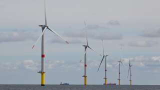Wind turbines are pictured on the first French offshore wind farm off the coasts of La Turballe, western France on September 30, 2022. - The wind farm, consisting of 80 wind turbines, will supply 480MW, with an investment of 2 billion euros (Photo by Damien MEYER / AFP)