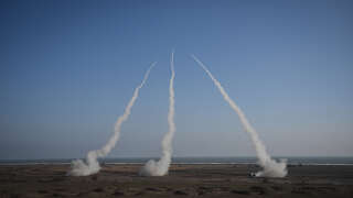 Three Romanian army HIMARS (High Mobility Artillery Rocket System)  fire rockets during 