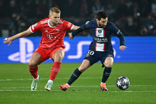 Paris Saint-Germain's Argentine forward Lionel Messi (R) fights for the ball with Bayern Munich's German midfielder Joshua Kimmich during the UEFA Champions League football match between Paris Saint-Germain (PSG) and Bayern Munich (FC Bayern Muenchen) at the Parc des Princes in Paris, on February 14, 2023. (Photo by Anne-Christine POUJOULAT / AFP)
