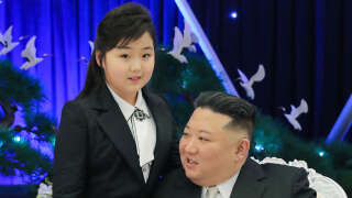 This picture taken on  February 7, 2023 and released from North Korea's official Korean Central News Agency (KCNA) on Fenruary 8, 2023 shows North Korean leader Kim Jong Un attending a banquet with his daughter is presumed to be Ju Ae  to mark the 75th anniversary of the Korean People's Army (KPA), in North Korea. (Photo by KCNA VIA KNS / AFP) / South Korea OUT / ---EDITORS NOTE--- RESTRICTED TO EDITORIAL USE - MANDATORY CREDIT 