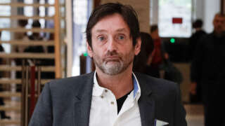 (FILES) In this file photo taken on June 06, 2019 French actor Pierre Palmade walks with a companion as he leaves The Paris Courthouse in Paris. - French actor and humorist Pierre Palmade remains in custody after a road accident in which he is involved which left three people seriously injured, including a child and a pregnant woman who lost her baby. (Photo by Geoffroy VAN DER HASSELT / AFP)