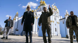 US President Joe Biden (C-L) walks with Ukrainian President Volodymyr Zelensky (C-R) at St. Michael's Golden-Domed Cathedral during an unannounced visit, in Kyiv on February 20, 2023. - US President Joe Biden promised increased arms deliveries for Ukraine during a surprise visit to Kyiv on February 20, 2023, in which he also vowed Washington's 