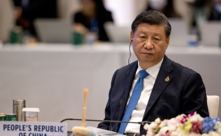 China’s President Xi Jinping looks on during the handover ceremony at the Asia-Pacific Economic Cooperation (APEC) summit in Bangkok on November 19, 2022.