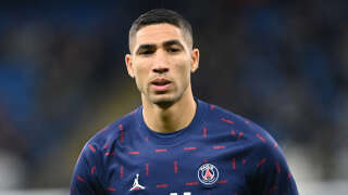 (FILES) In this file photo taken on November 24, 2021 Paris Saint-Germain's Moroccan defender Achraf Hakimi warms up ahead of the UEFA Champions League Group A football match between Manchester City and Paris Saint-Germain at the Etihad Stadium in Manchester, north west England. - Paris Saint-Germain's Moroccan defender Achraf Hakimi is under investigation for rape. (Photo by Paul ELLIS / AFP)