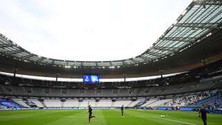 Paris Saint-Germain's players warm up in a near-empty stadium as attendence is limited for COVID-19 (novel coronavirus) safety measures during the French Cup final football match between Paris Saint-Germain (PSG) and Saint-Etienne (ASSE) on July 24, 2020, at the Stade de France in Saint-Denis, outside Paris. (Photo by FRANCK FIFE / AFP)