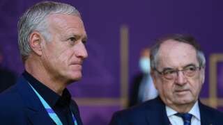France's coach Didier Deschamps (L) and French Football Federation (FFF) President Noel Le Graet (R) arrive for the draw for the 2022 World Cup in Qatar at the Doha Exhibition and Convention Center on April 1, 2022. (Photo by FRANCK FIFE / AFP)