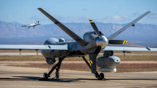 FORT HUACHUCA, ARIZONA - NOVEMBER 04: An MQ-9 Reaper drone with Customs and Border Protection (CBP) awaits a mission over the U.S.-Mexico border on November 04, 2022 at Fort Huachuca, Arizona. CBP air interdiction agents with U.S. Air and Marine Operations (AMO) pilot the surveillance drones from the base to intercept immigrants crossing illegally from Mexico into remote and rugged areas of southeastern Arizona.   John Moore/Getty Images/AFP (Photo by JOHN MOORE / GETTY IMAGES NORTH AMERICA / Getty Images via AFP)