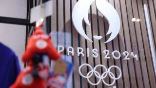 This photograph taken on November 15, 2022, in Paris, shows the Paris 2024 Olympic and Paralympic Games official logo, displayed in the official Paris 2024 shop in Les Halles shopping mall in central Paris. - The Olympic and Paralympic mascots are named 